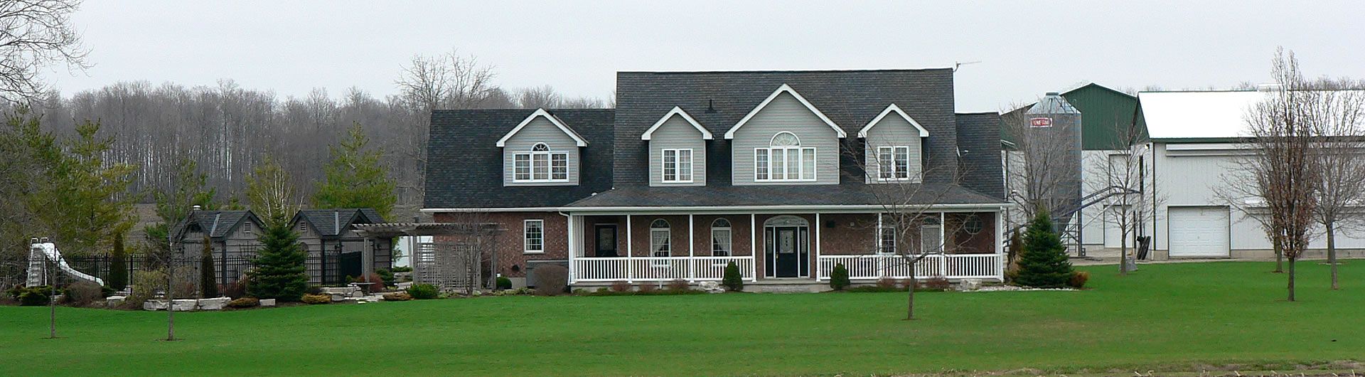 Country home with farm in background